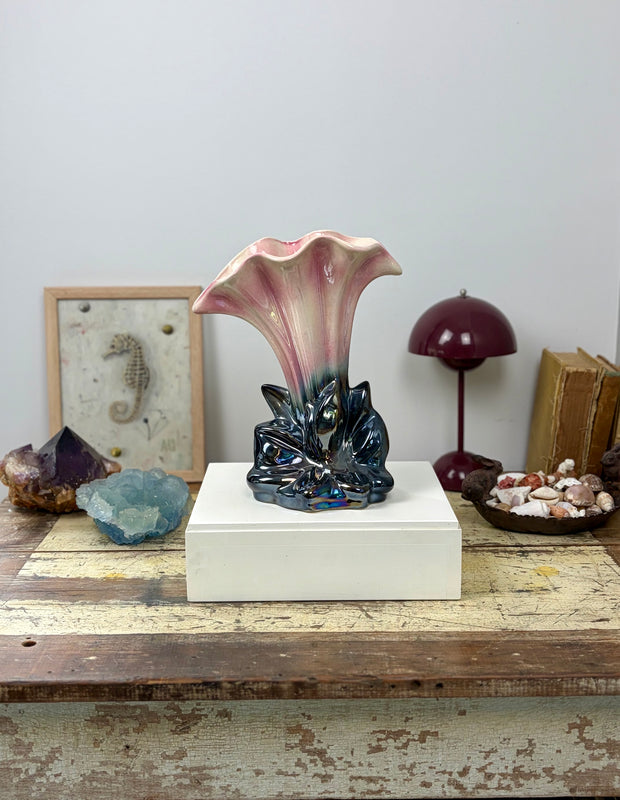 Pates Potteries lustreware mantle vase shape 941 on white plinth styled with vintage decorative objects and art against a grey wall