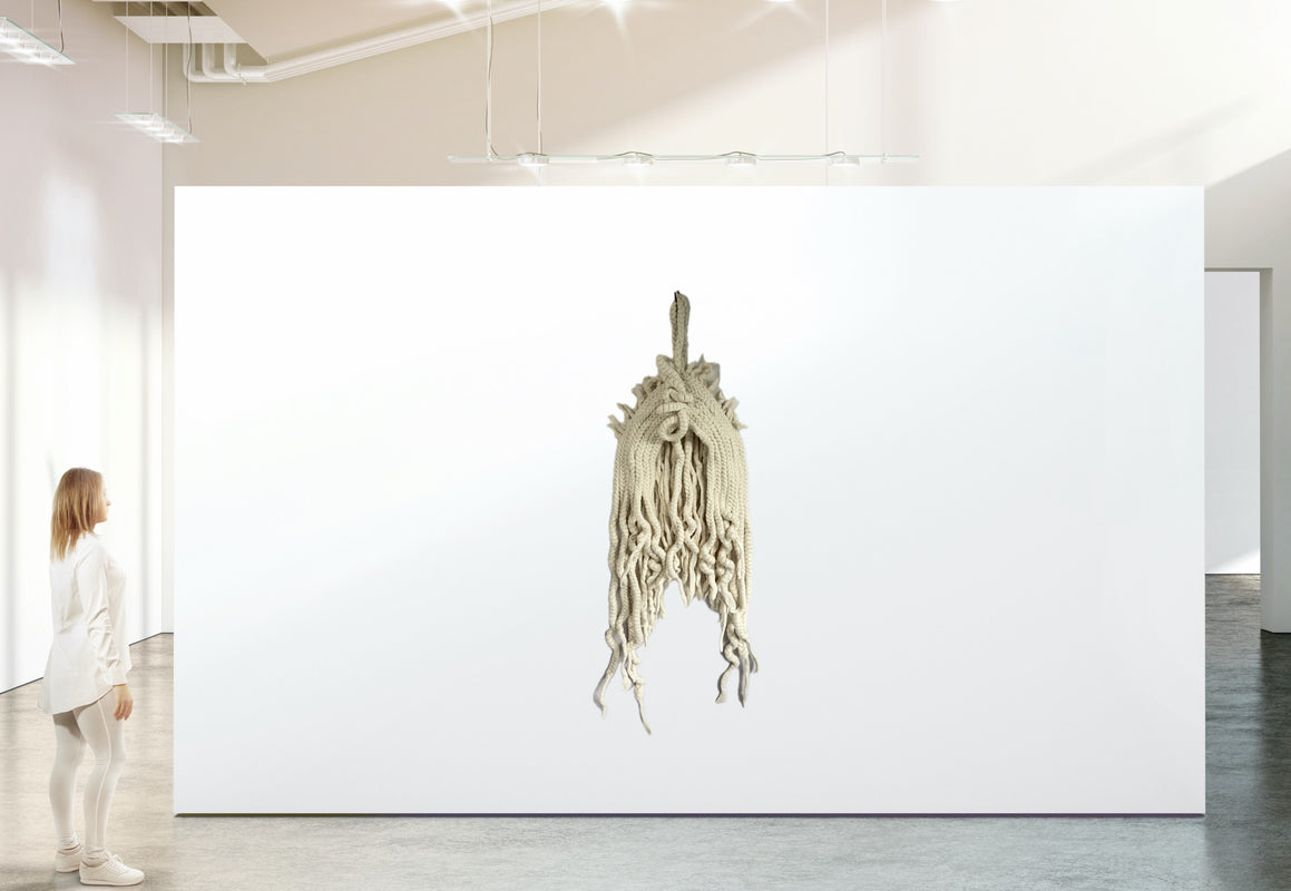 Art installation in a gallery with a person observing
