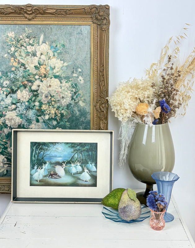 Vintage framed Giselle ballet print by Carlotta Edwards styled on white cupboard with mid-century home decor